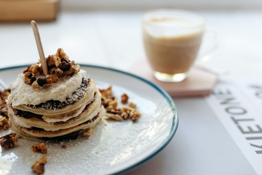 Pancakes and coffee on the table in a cafe.